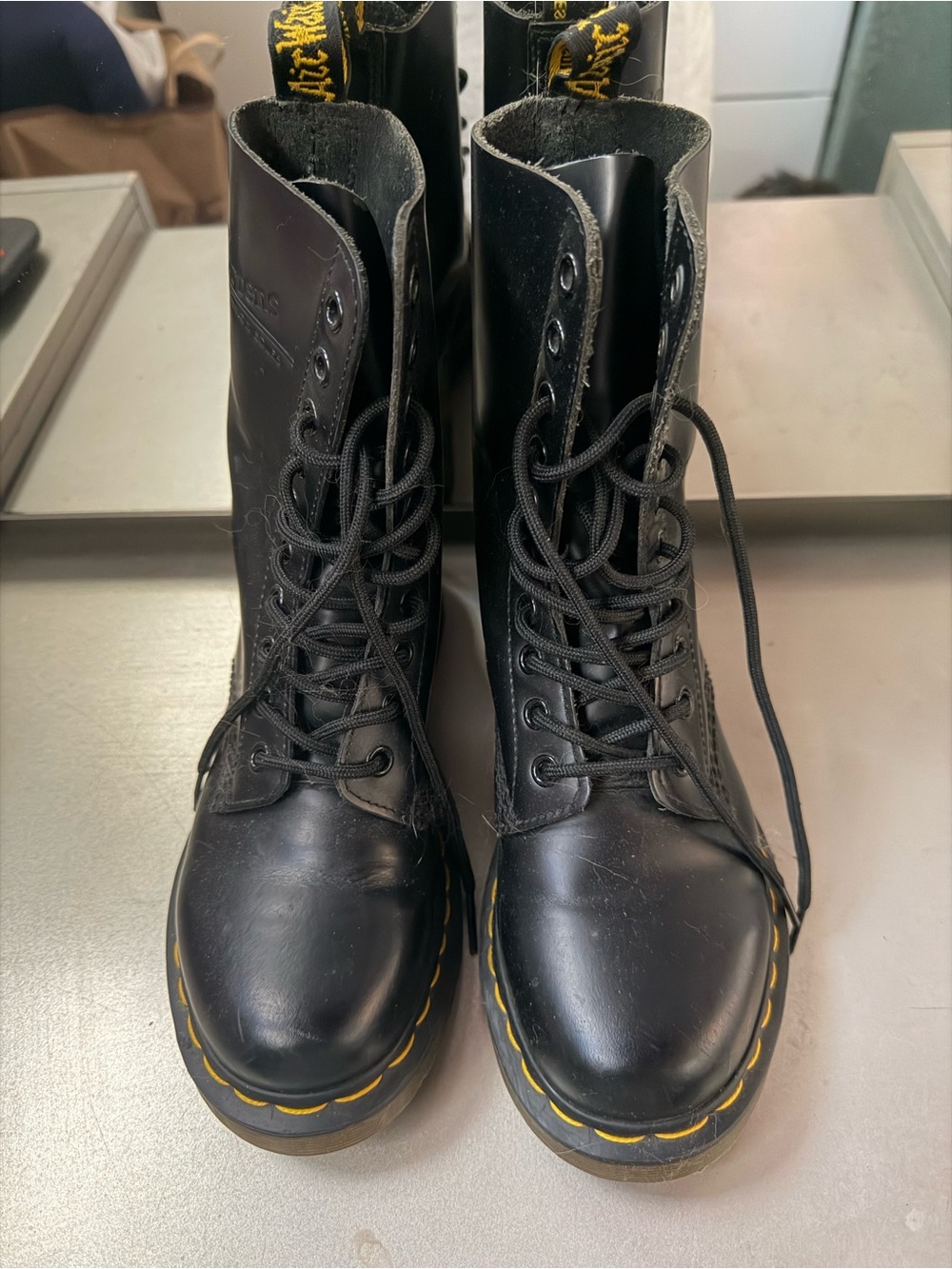 Dr. Martens Black Leather 10-Eye Boots with Yellow Stitching
